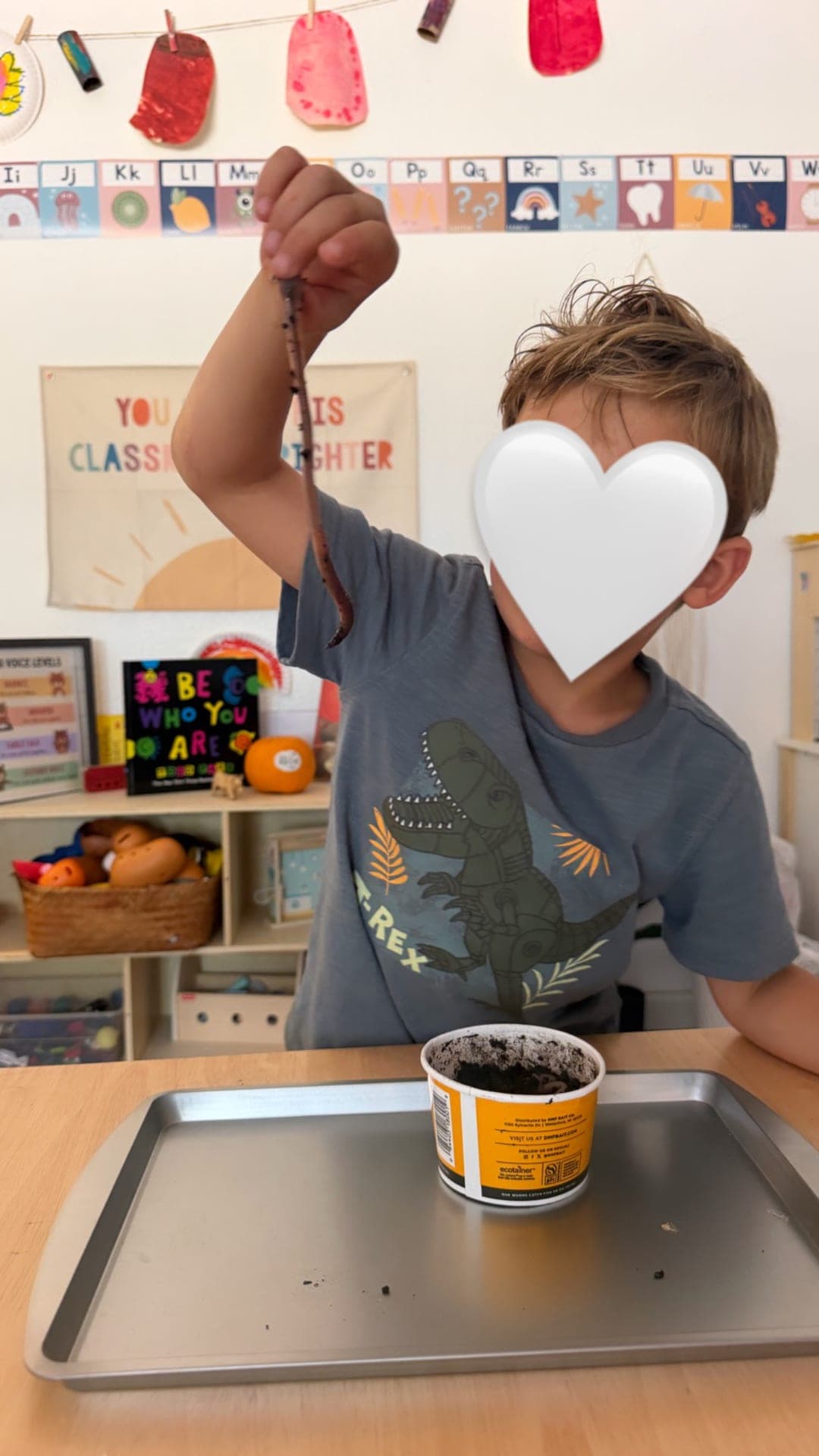 Primary science — observing an earthworm during chicken coop investigation