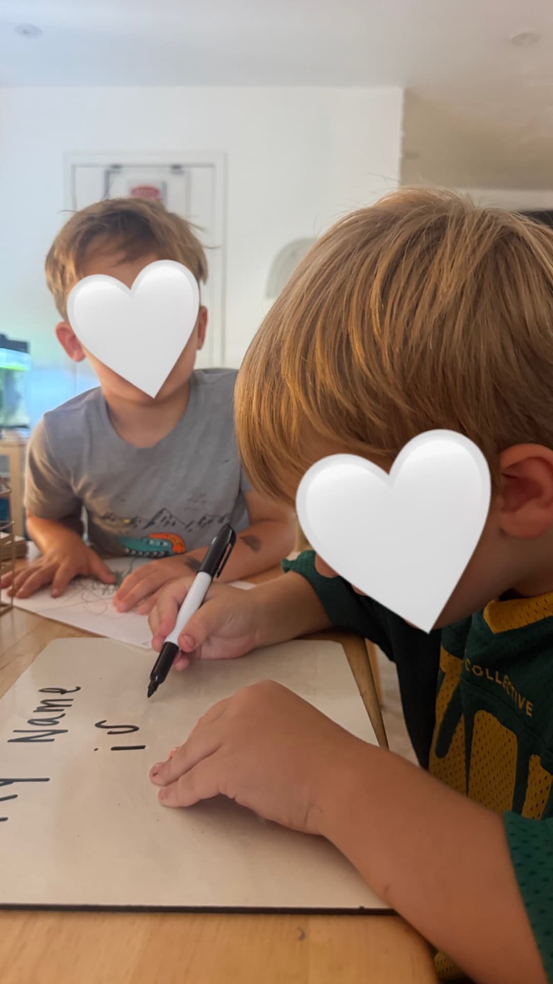 Practicing "My Name is" on whiteboards