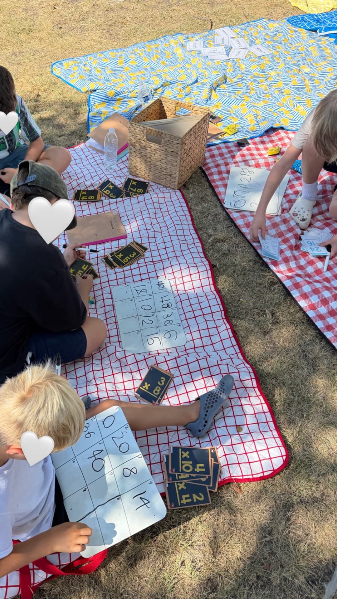 Outdoor multiplication practice with flashcards and whiteboards