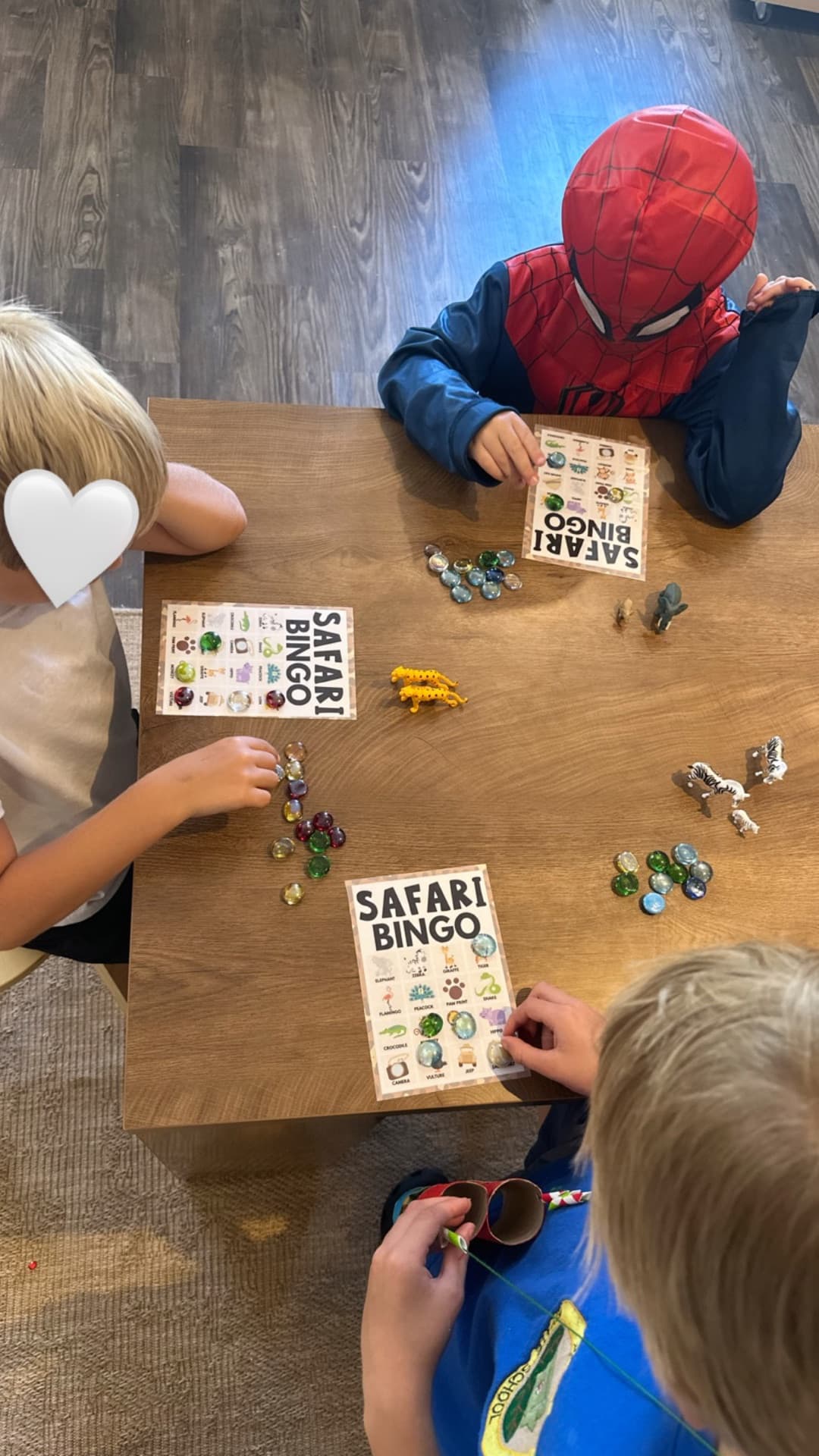 Safari bingo with animal figurines and glass markers