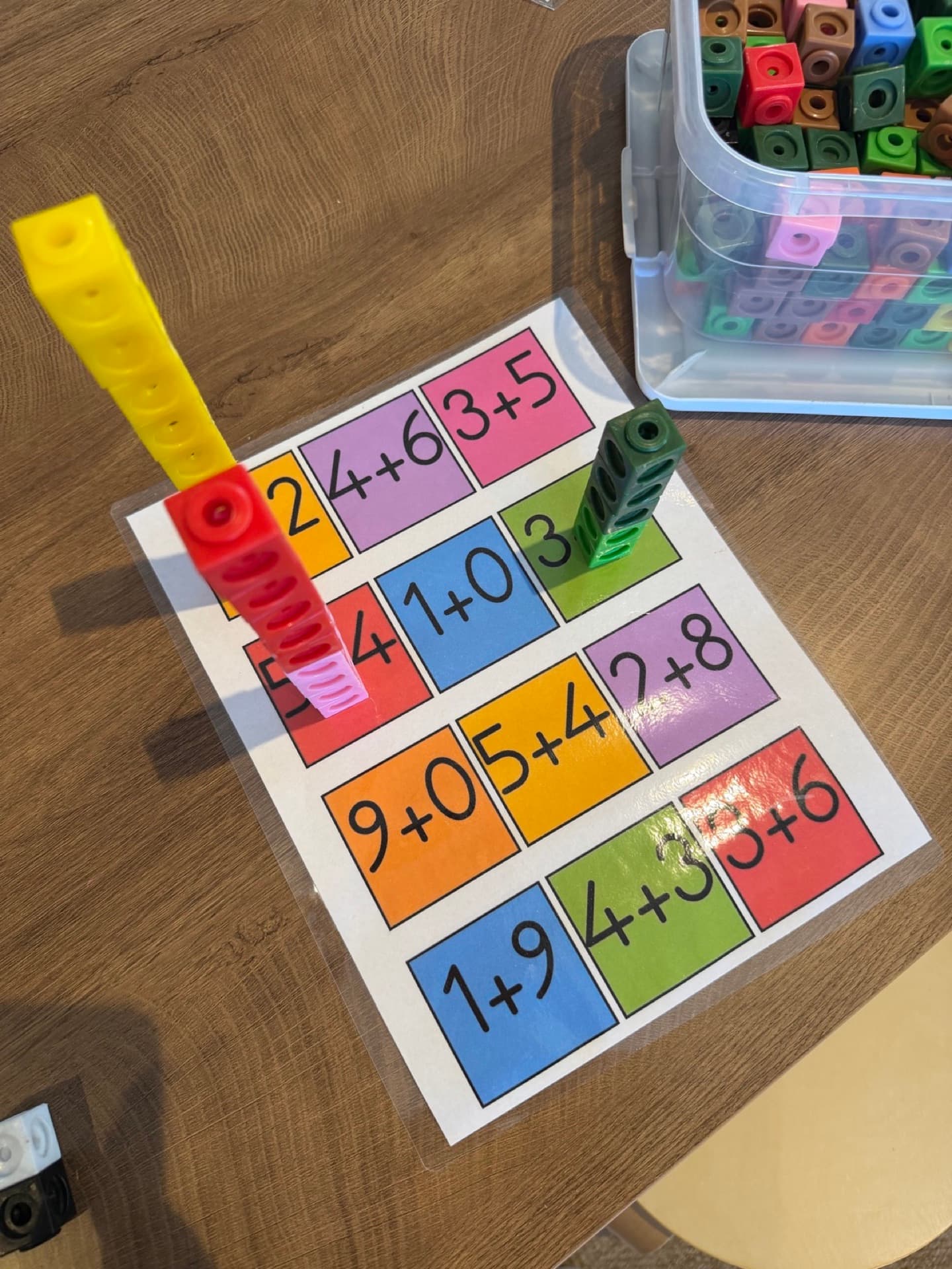 Building addition towers with linking cubes