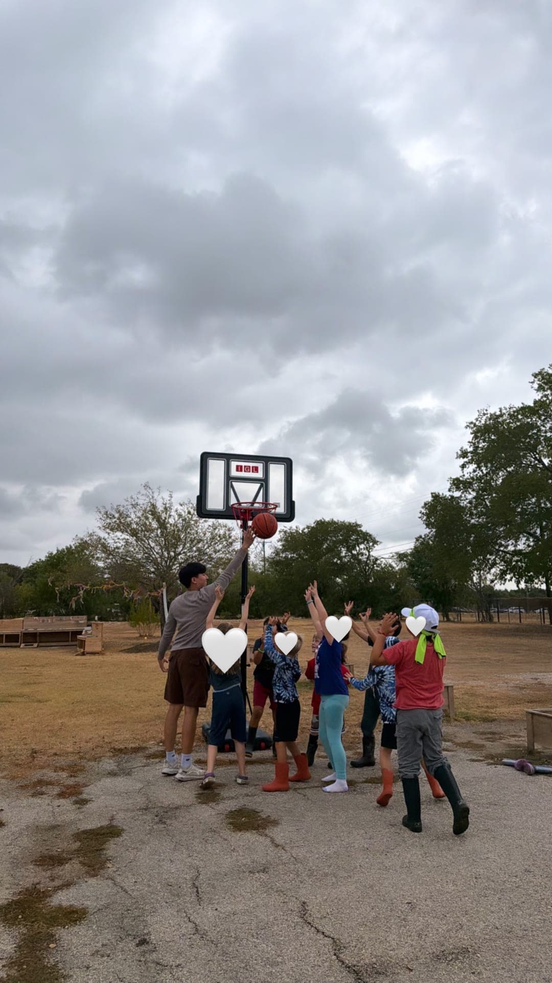 Group basketball reach at the hoop together