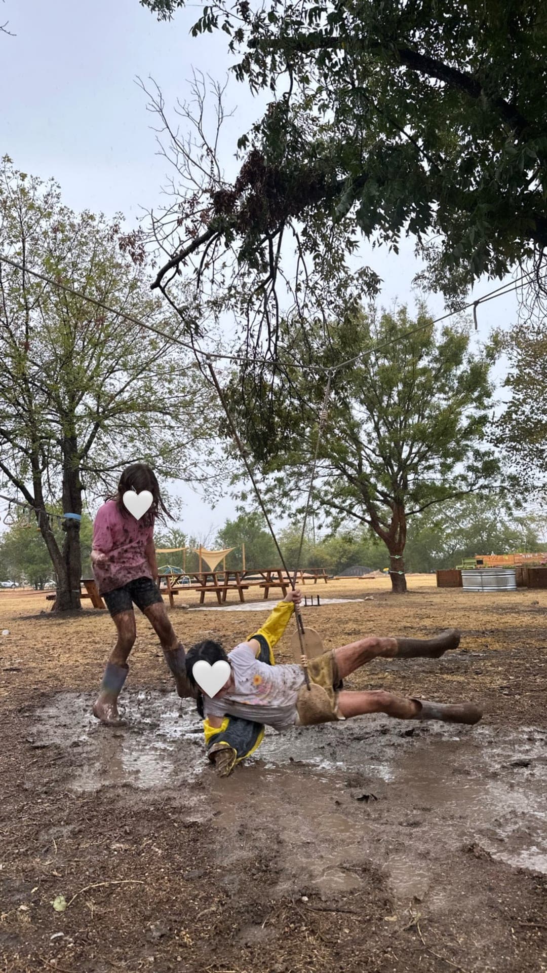 Primary — joyful mud puddle play after rain