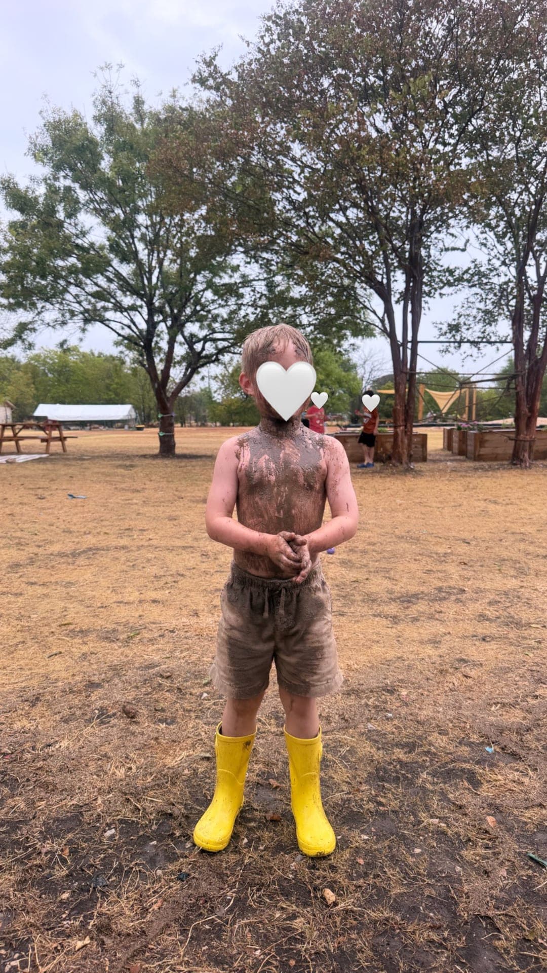 Full-body mud play across the open field