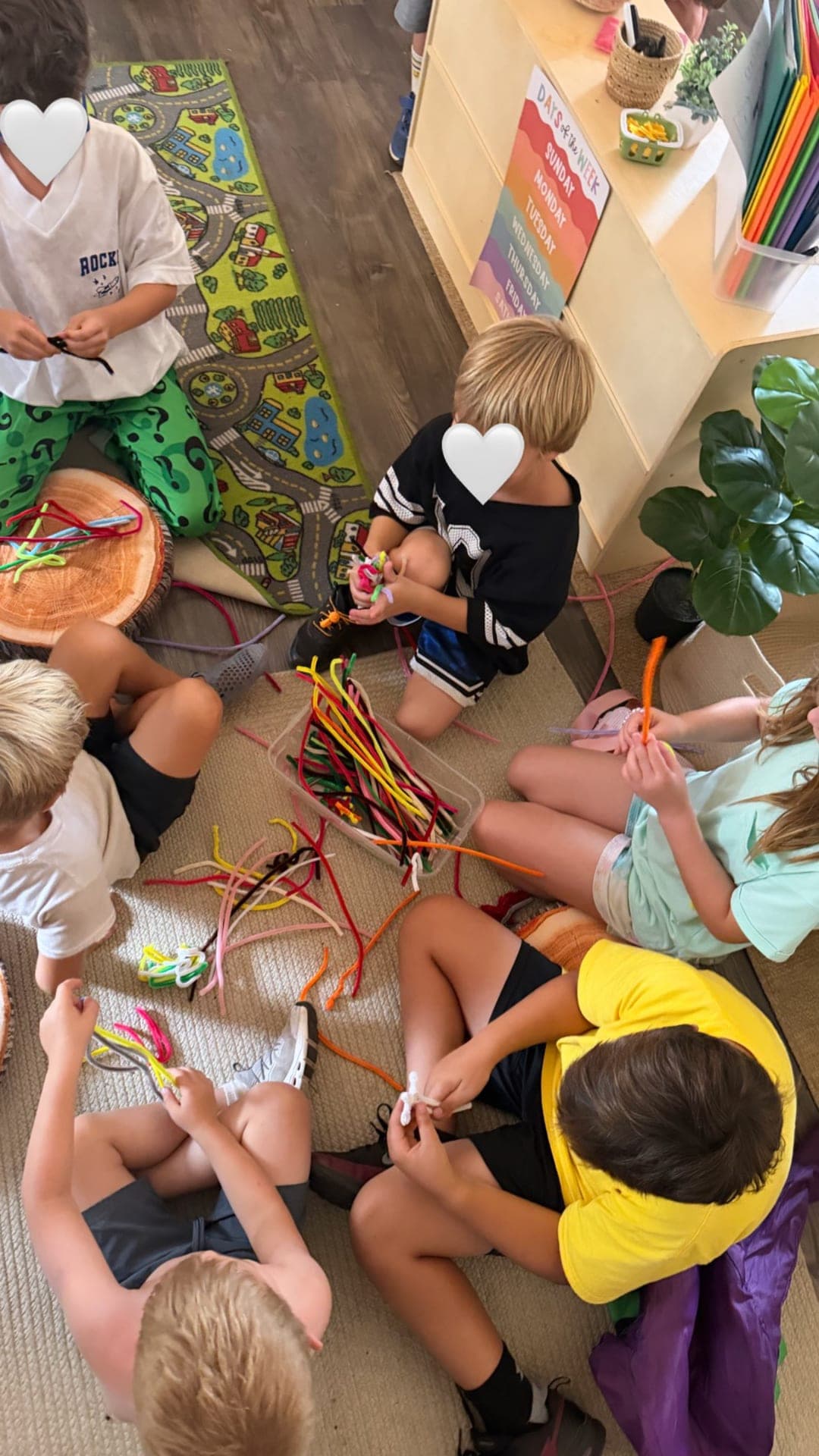 Primary — pipe cleaner building in a classroom circle