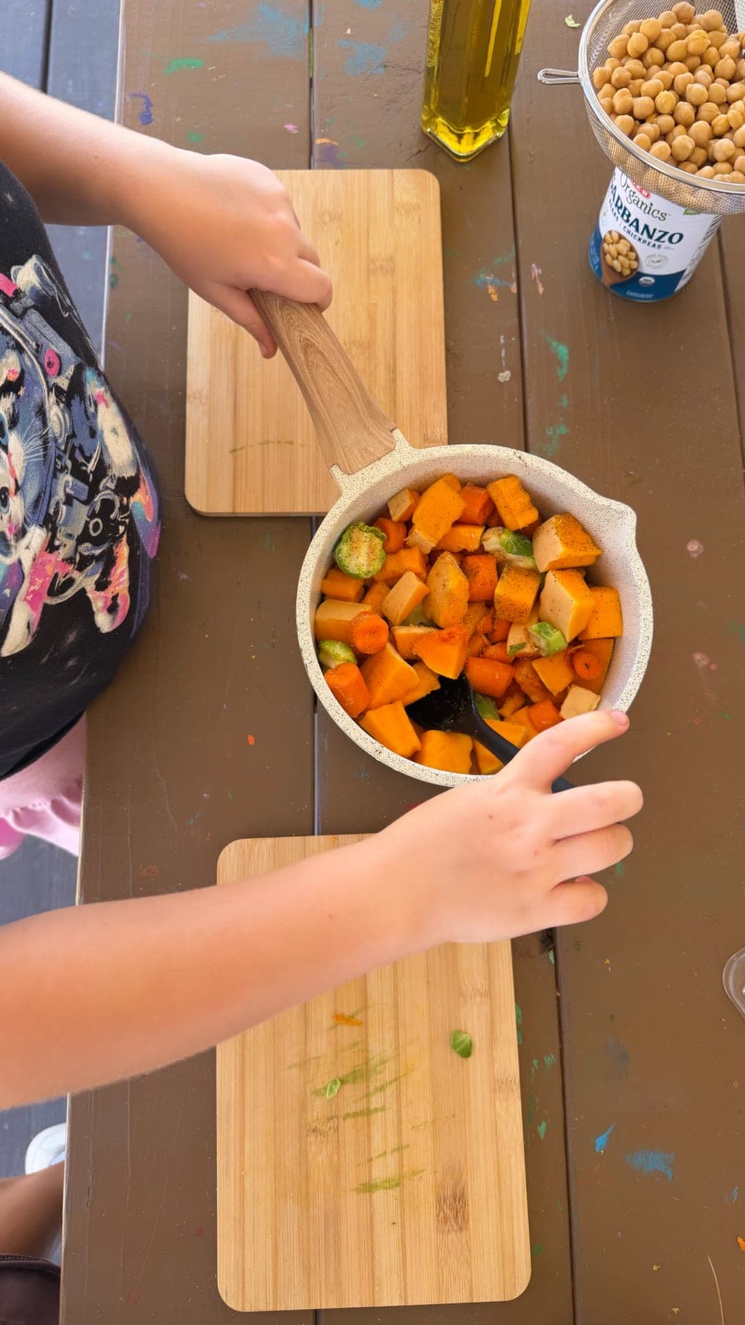 Upper elementary — chopping harvest veggies for quinoa bowls in cooking