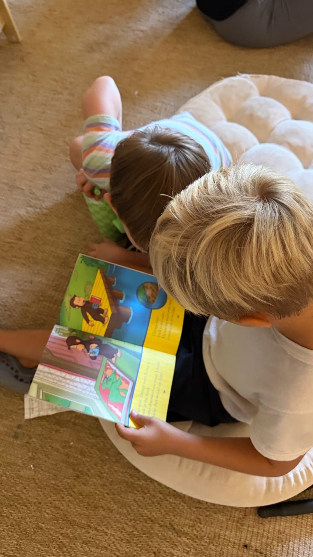 Primary — Curious George read-aloud on floor cushions