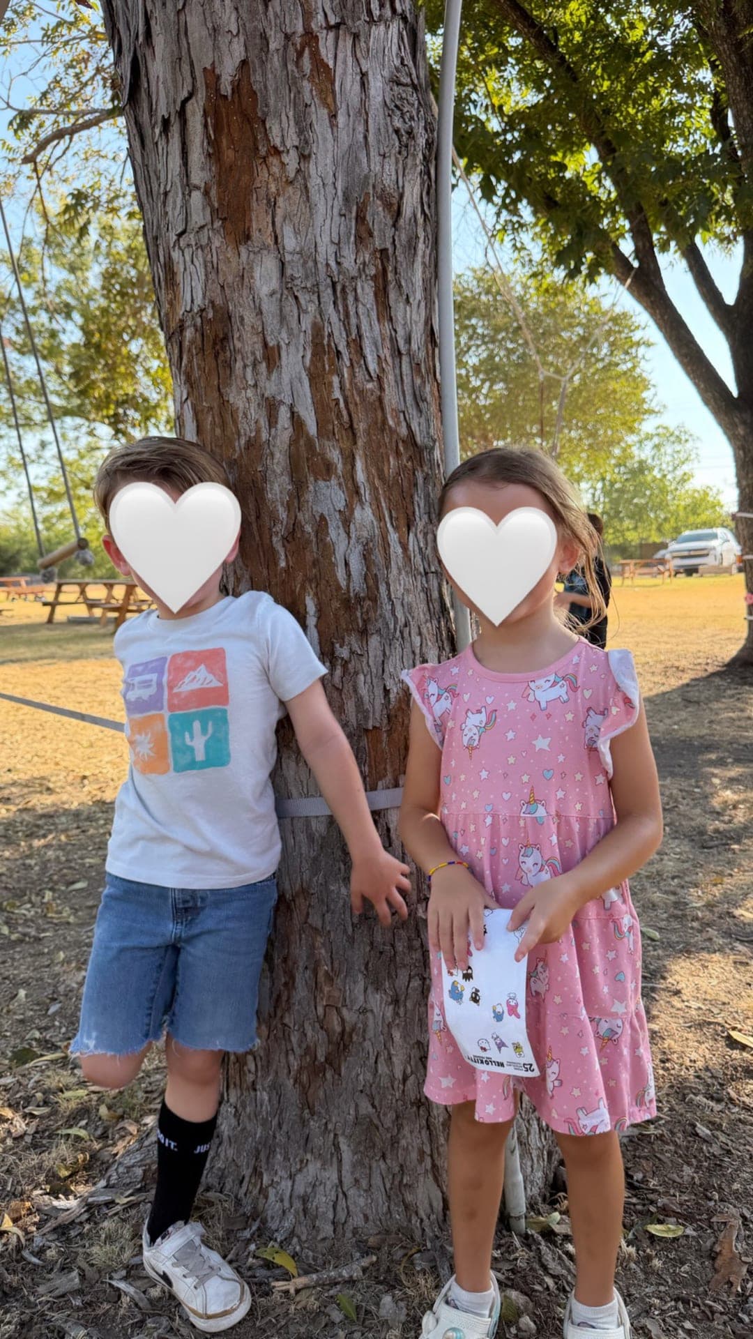 Friends posing together at the big tree on the playground