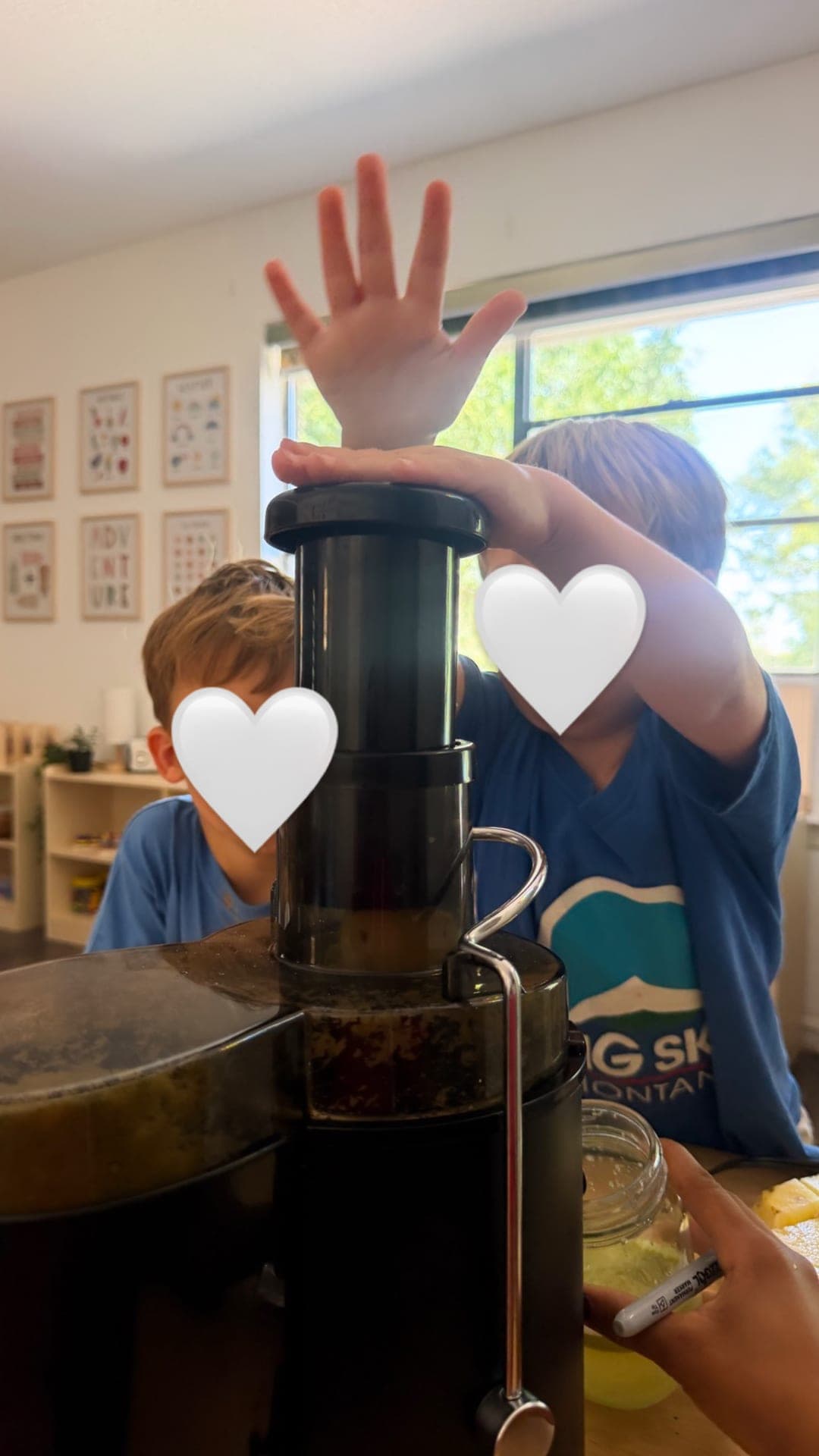 Primary students making fresh juice with a homemade juicer