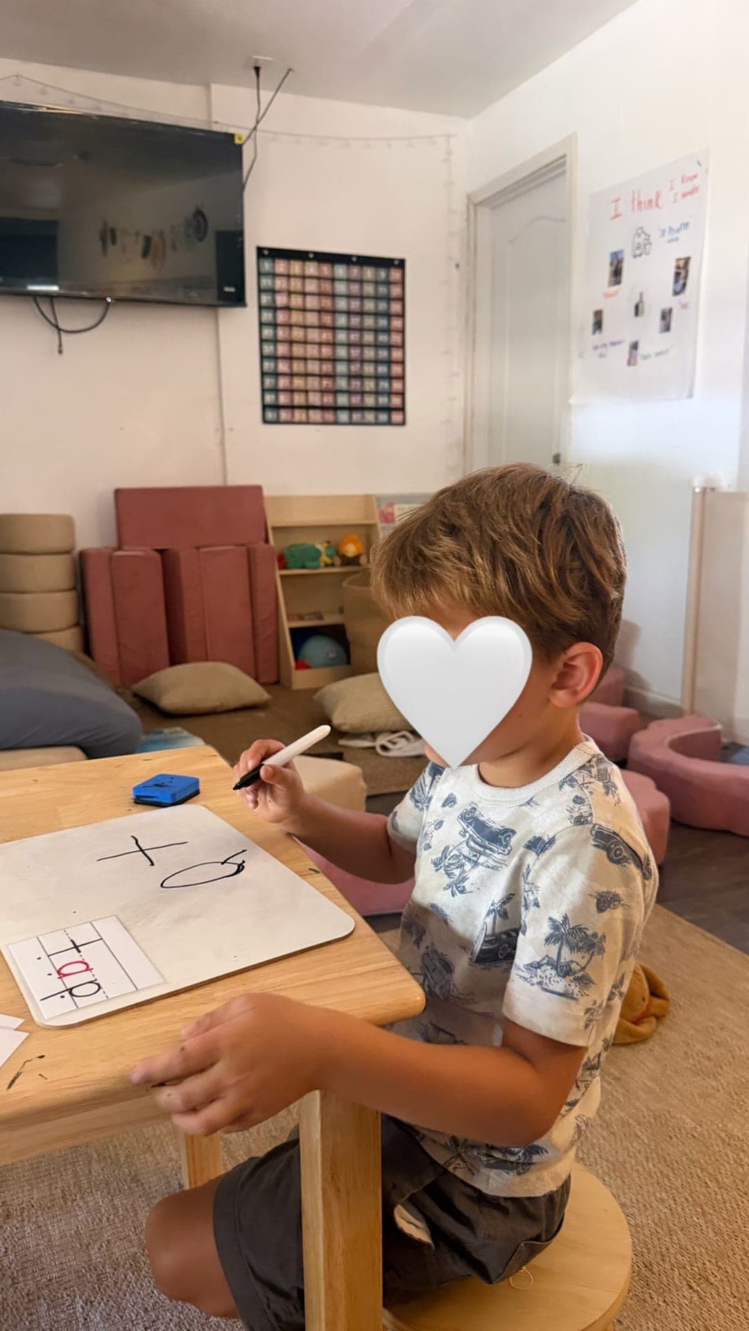 Phonics practice — writing on a handheld whiteboard