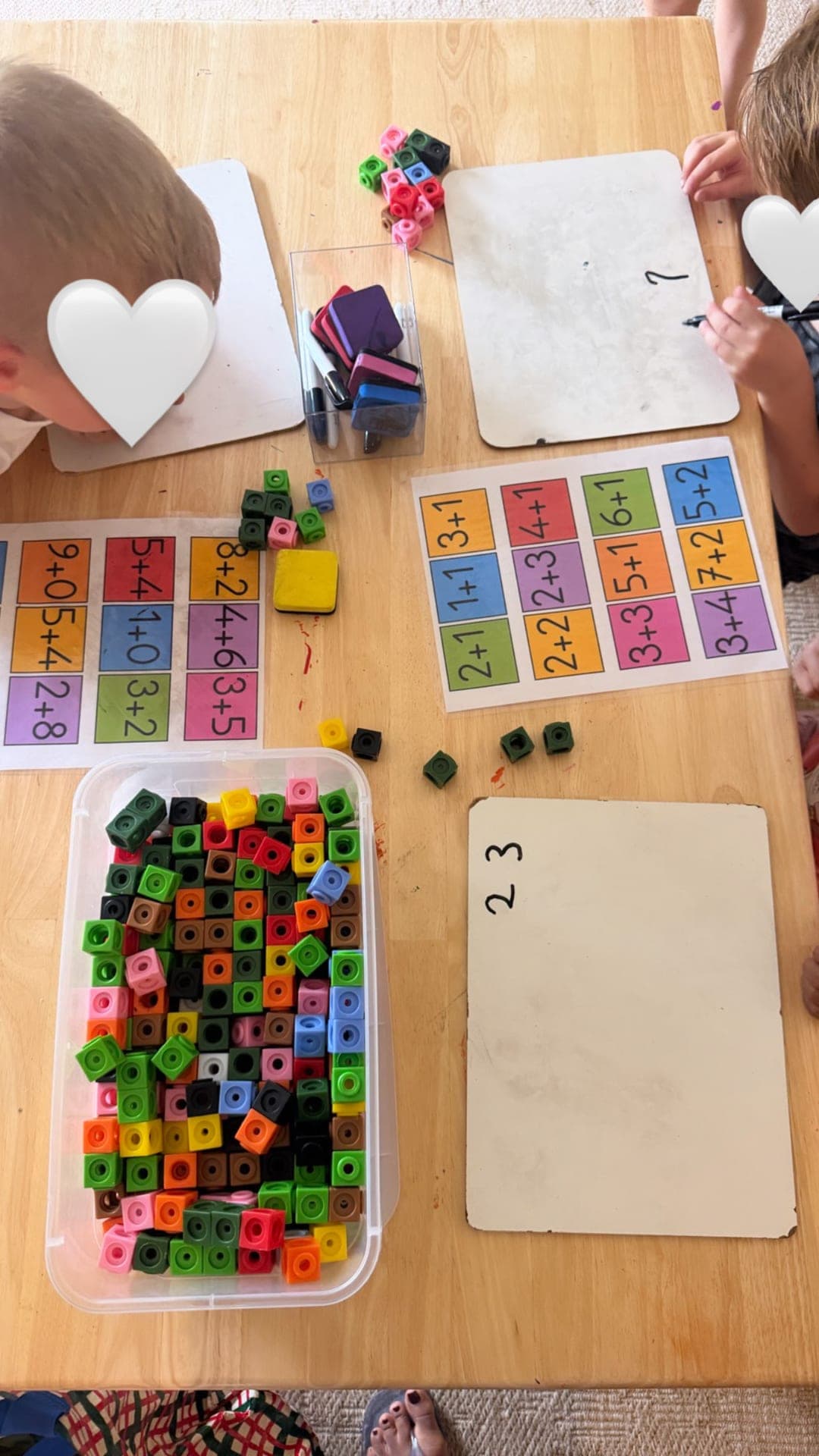 Partner addition practice with linking cubes and whiteboards