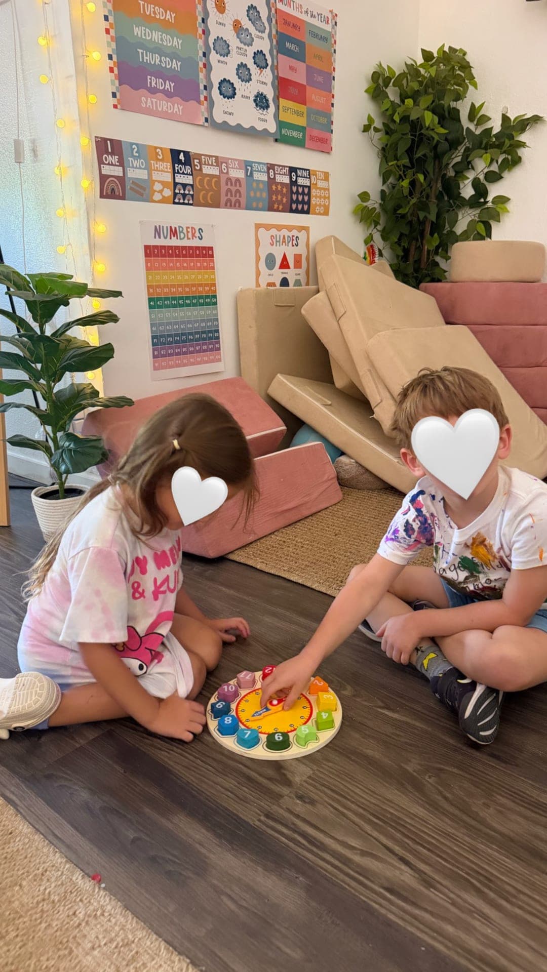 Primary students exploring a wooden clock puzzle together