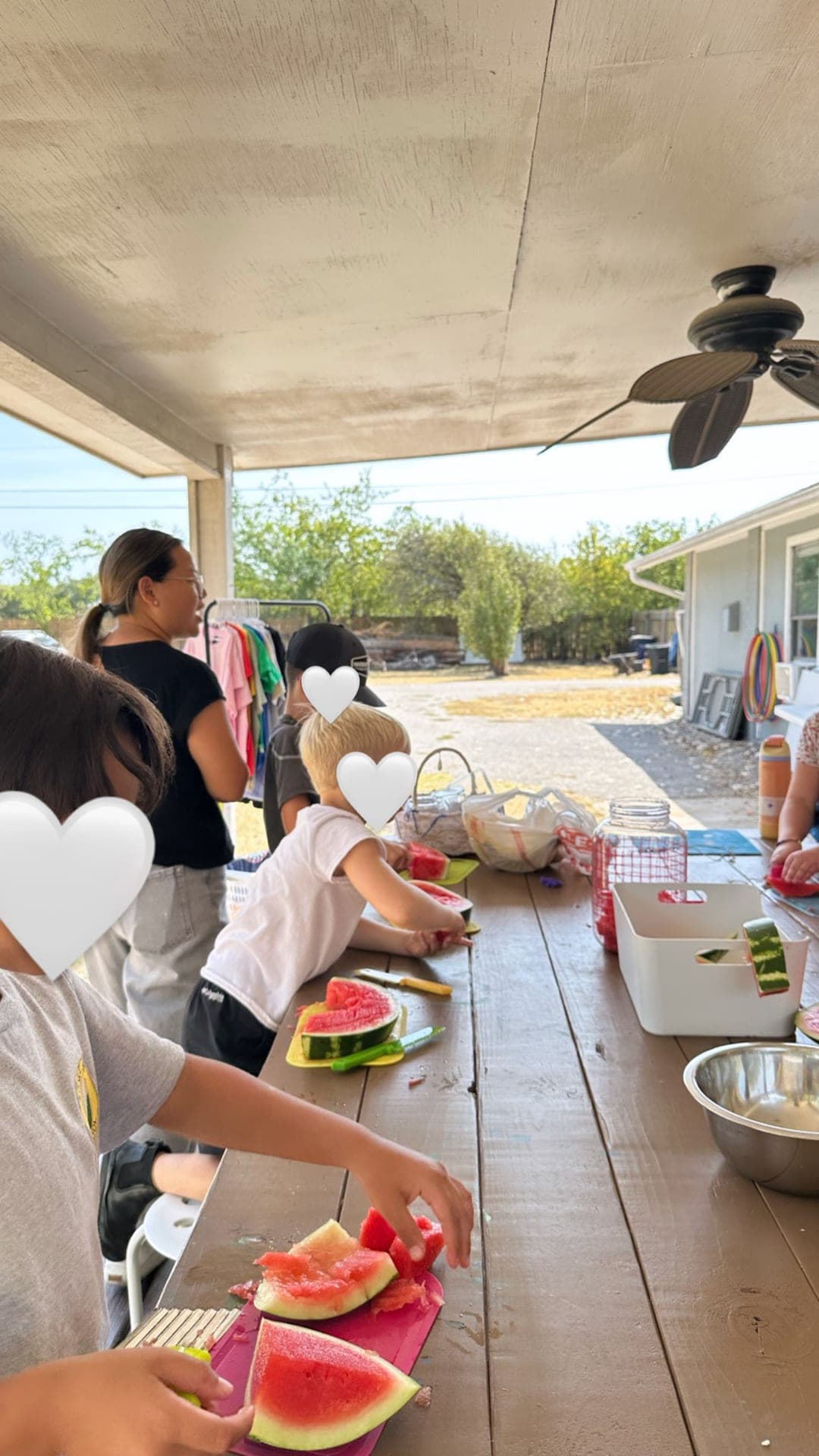 Preparing fresh watermelon for the community garden event