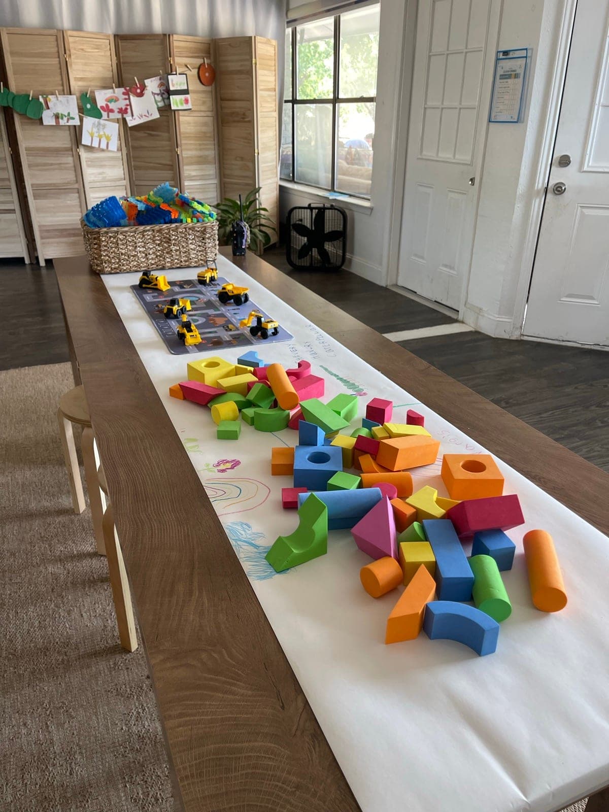 Construction Zone play table — foam blocks, toy trucks, and building toys