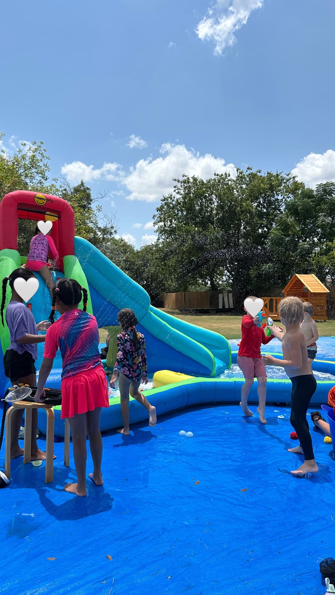 Water slide and splash pad — racing down slides one last summer stretch