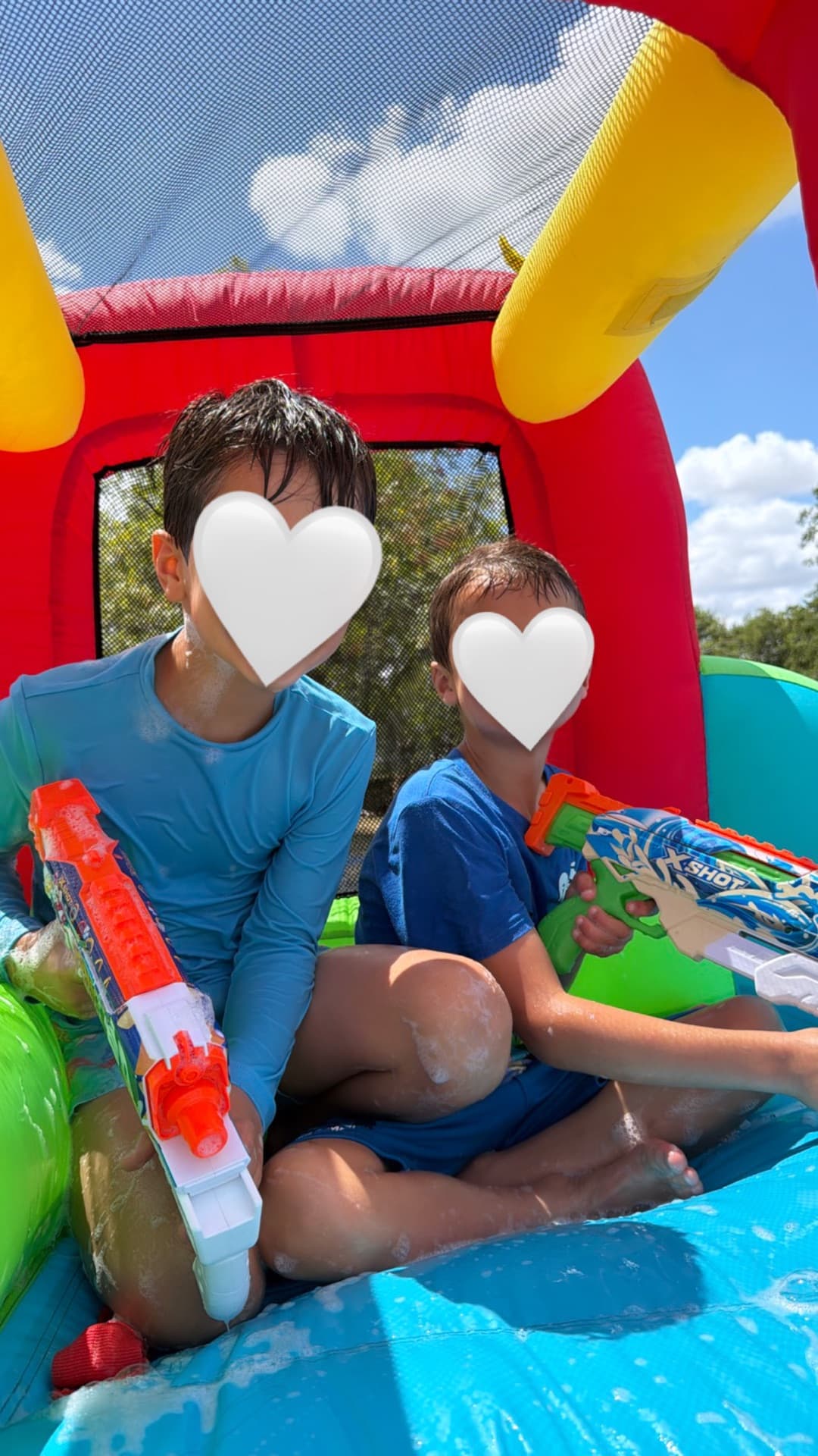 Foam, water blasters, and a bounce house — racing down slides one more time
